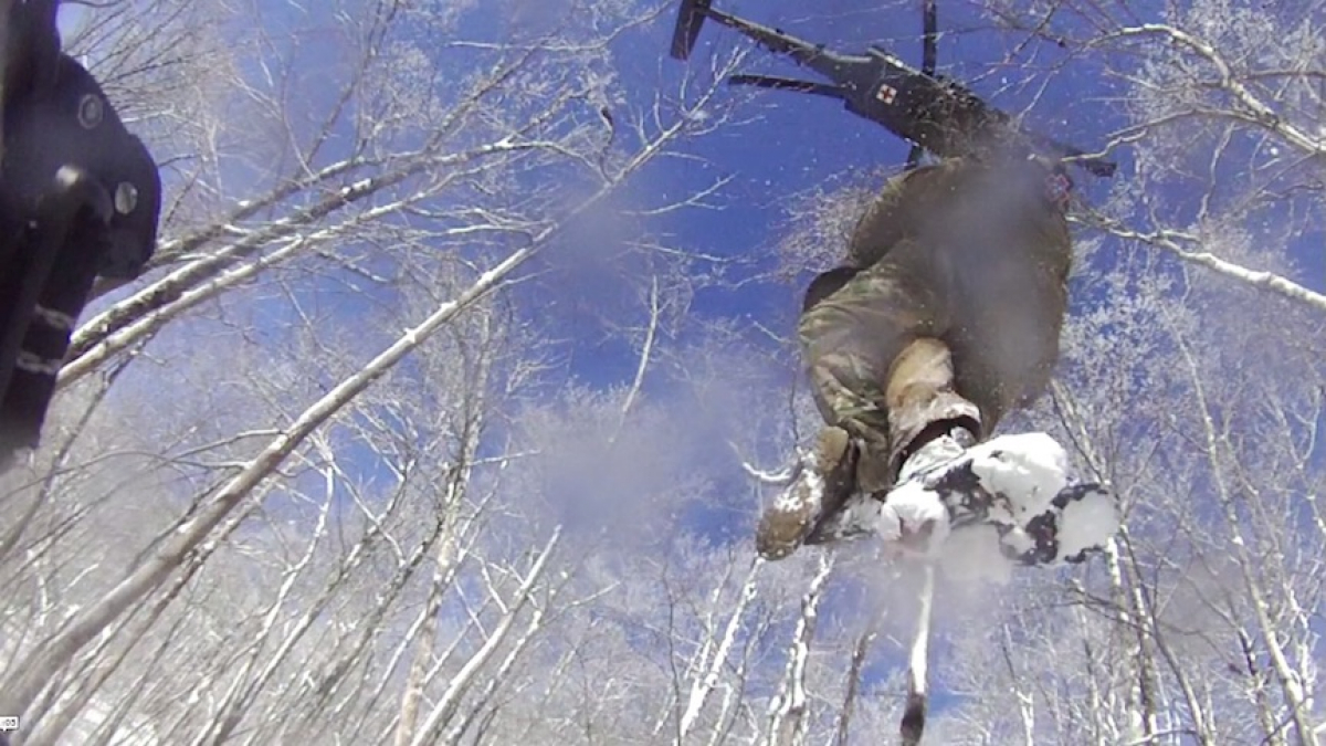 The stranded hiker and rescuing medics are hoisted up to the medical UH60 Army Blackhawk. NPS photo