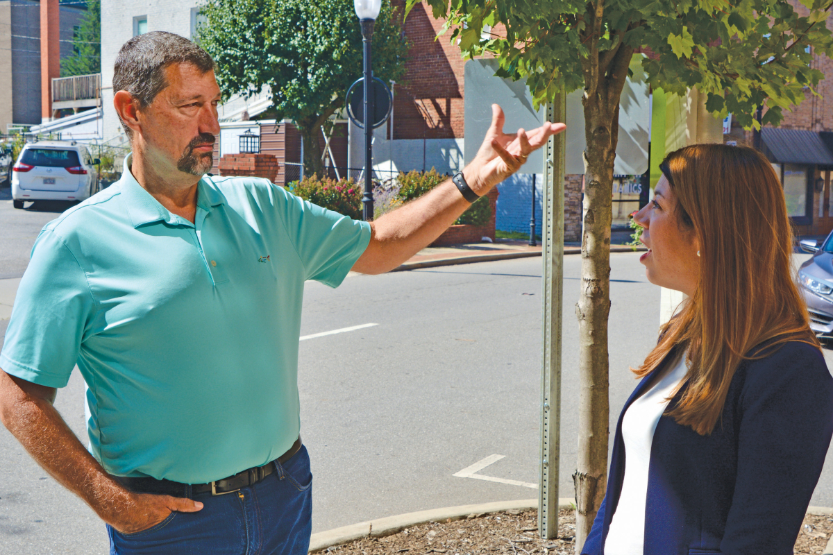 Haywood County Republican Rep. Mark Pless (left) speaks on Aug. 17 in Canton with Elizabeth Biser, secretary of North Carolina’s Department of Environmental Quality.  Cory Vaillancourt photo