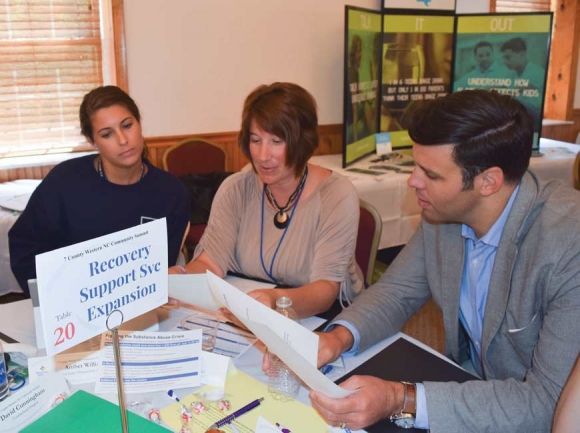 Graham County Health Educator Amber Williams, (from left) Graham County Health Director Beth Booth and Canton Mayor Zeb Smathers take on the issue of transitional housing for people in recovery during the 7 County Summit in Bryson City. Jessi Stone photo