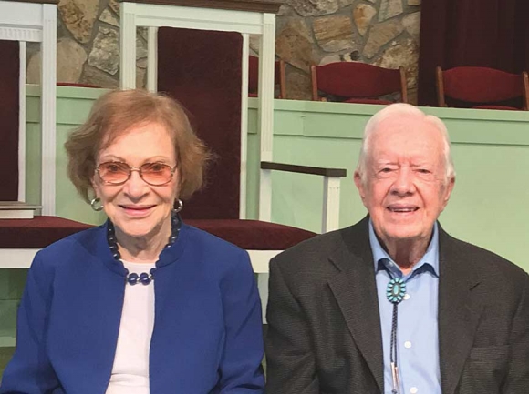 President Jimmy Carter (right) and wife Rosalynn sit in the sanctuary at Maranatha Baptist Church in Plains, Ga. Cory Vaillancourt photo