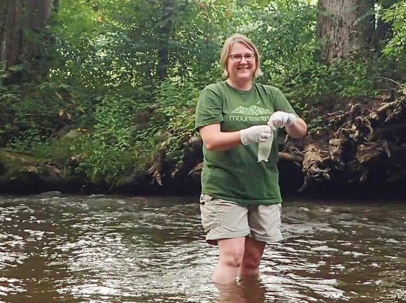 Western Regional Director Callie Moore collects a water sample. MountainTrue photo