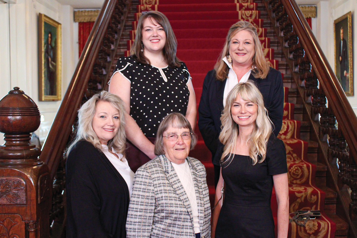 The Mountain Projects GetCoveredWNC team of Healthcare Navigators on the stairs of the Governor’s Mansion in Raleigh at a recent event celebrating Healthcare Navigators Month. Clockwise from top right: Program Manager Jan Plummer, Caitlin Quinnett, Jane Harrison, Susan Rose and Savanna Rickman. Unable to make the trip were Marilyn Tollie and Linda Curtis. Donated photo