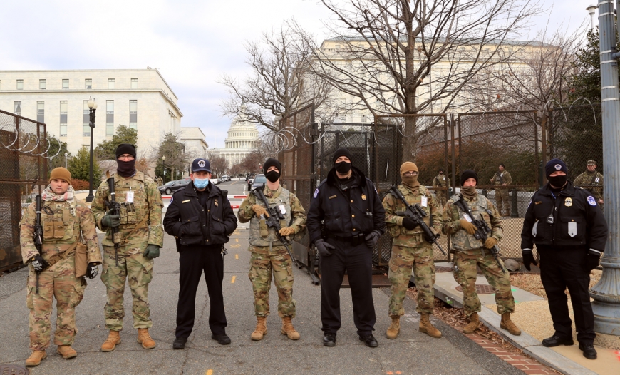 Capitol Police and National Guardsmen stand before a checkpoint on Washington, D.C.&#039;s South Capitol Street on Jan. 19. 