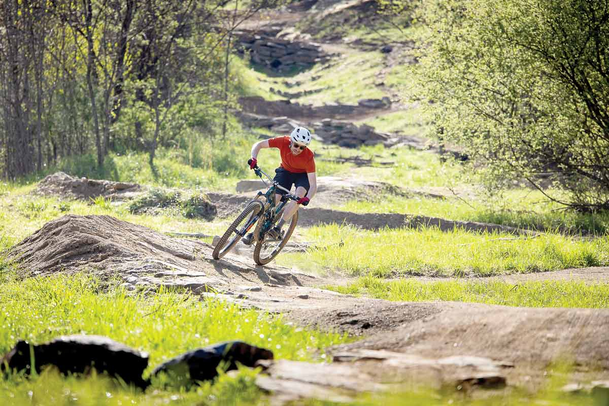 A mountain biker curves along a trail in Berm Park, the mountain biking skills course within Canton’s Chestnut Mountain Nature Park. Great State Trails Coalition photo