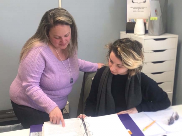 Destri Leger, Jackson County Coordinator for Center for Domestic Peace (right) and Victim Advocate Ruby Lawrence talk about CDP’s transition into a standalone agency. Jessi Stone photo