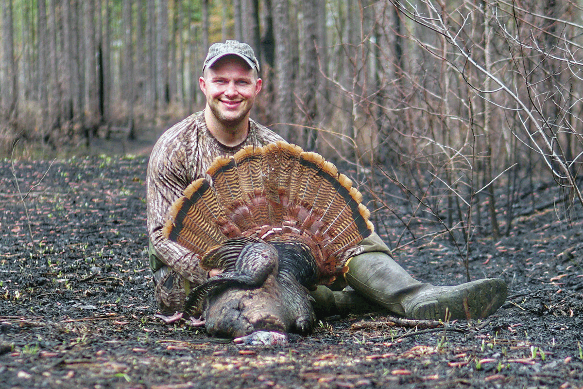 A turkey hunter poses after a successful hunt. Beau Leyse photo 