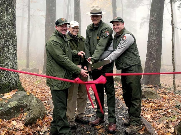 Friends of the Smokies and Great Smoky Mountains National Park representatives cut the ribbon Nov. 14 on the rehabilitated Rainbow Falls Trail. NPS photo 