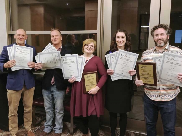 Smoky Mountain News staff (from left) Scott McLeod, Cory Vaillancourt, Jessi Stone,      Holly Kays and Garrett K. Woodward stop for a photo at the NCPA awards ceremony in Raleigh on Feb. 27. Donated photo