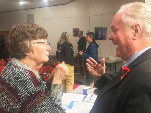 Rep. Joe Sam Queen (right) talks with a constituent Feb. 16 in Waynesville. Cory Vaillancourt photo