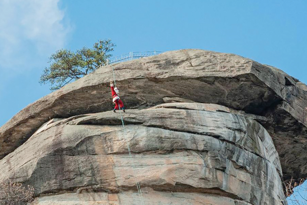 Santa Claus rappels down Chimney Rock. Donated photo