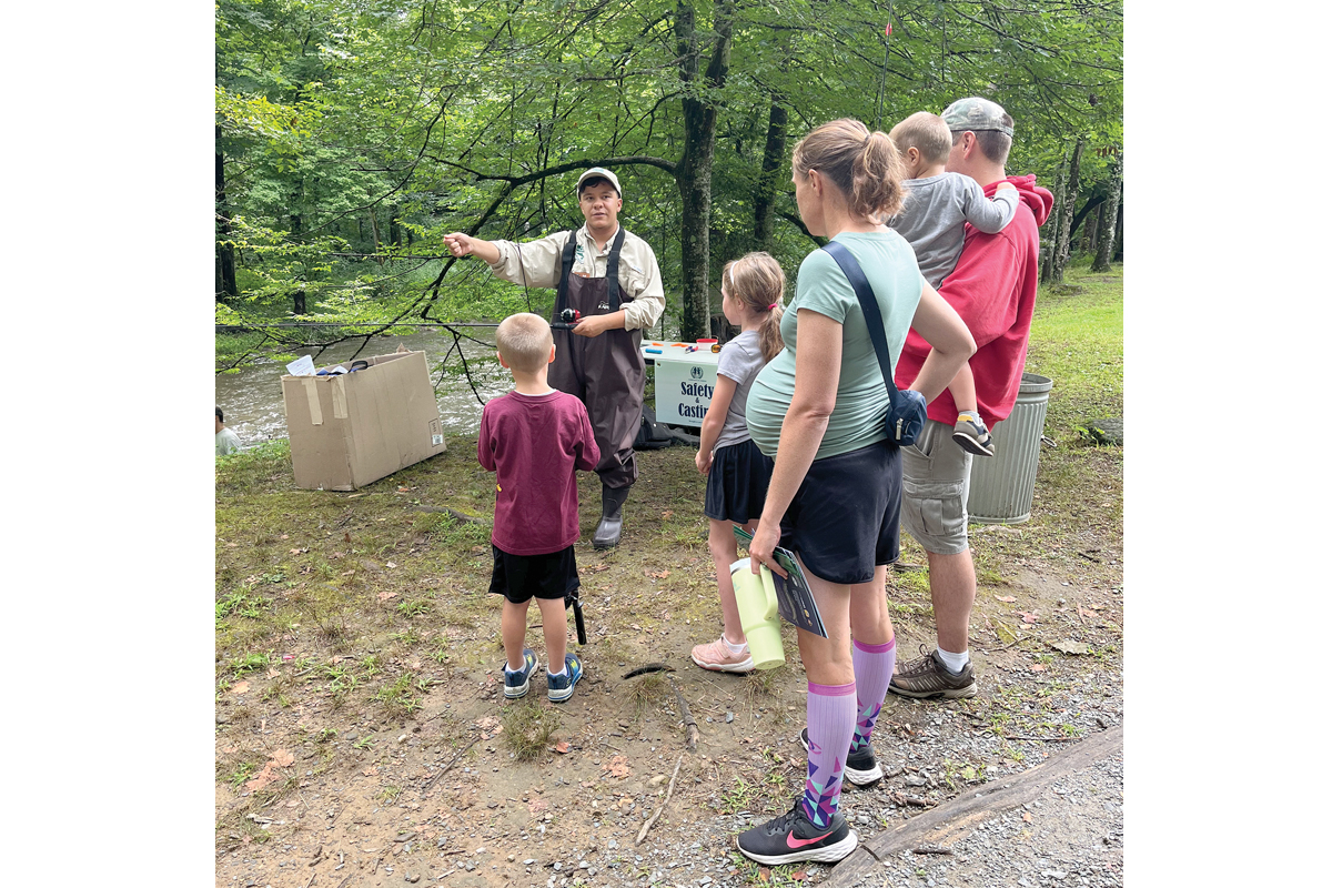 A family takes it all in during a previous fishing clinic. NPS photo