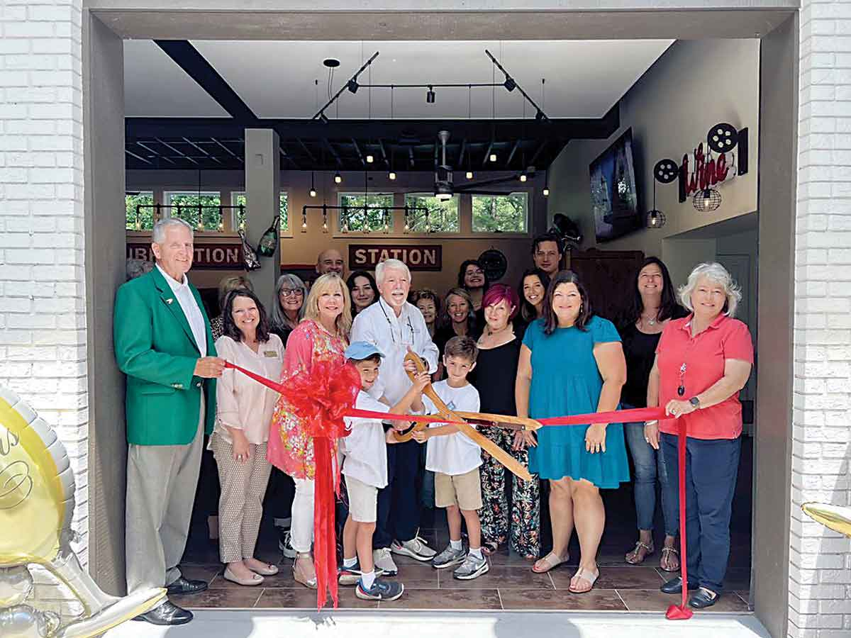 Slanted Window Tasting Station cuts the ribbon