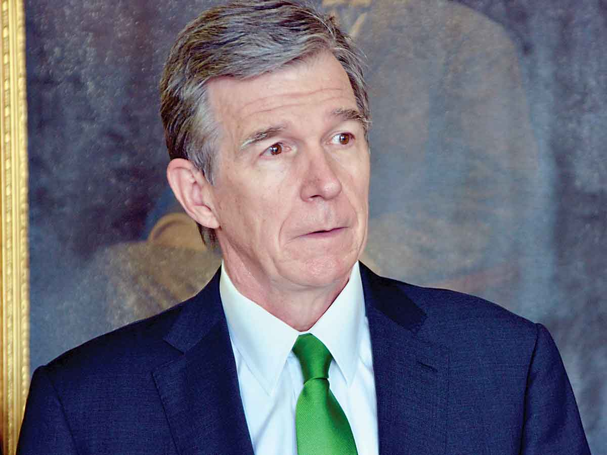 Gov. Roy Cooper speaks at a press conference in Waynesville on March 15. Cory Vaillancourt photo