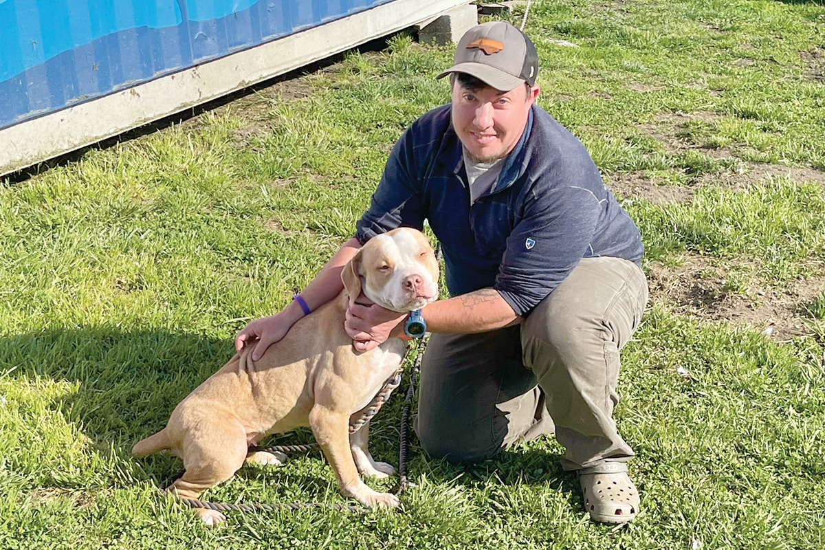 River Eure, pictured here with Misfit Mountain dog Zennia, has worked in animal shelters in the past, but Koda was the first dog he’d fostered for the rescue. Kyle Perrotti photo