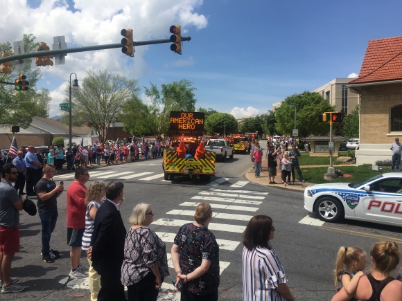 Riley Howell&#039;s motorcade nears Wells Funeral Home in downtown Waynesville on May 2. Greg Boothroyd photo