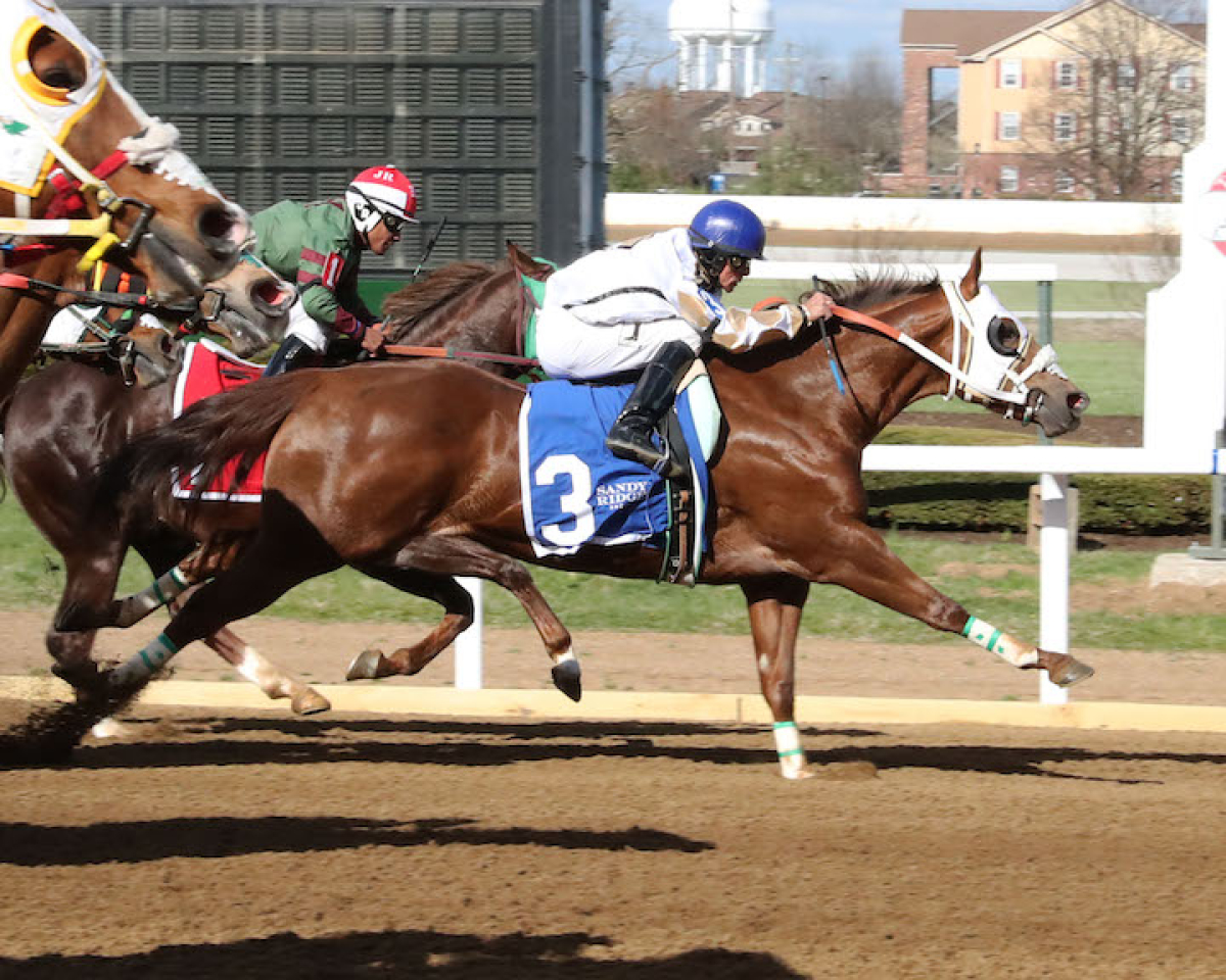 Horses strain toward the finish line during the Cherokee Stakes honoring the Eastern Band of Cherokee Indians on opening day April 1. Revolutionary Racing Kentucky photo 