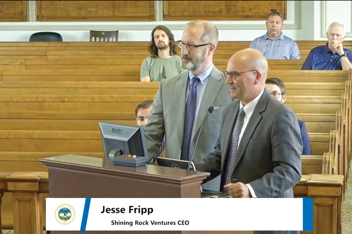 Jesse Fripp (right) and David Lilly of Shining Rock Ventures present the results of their “listening post” exercise to Haywood County commissioners on July 15. Haywood County photo