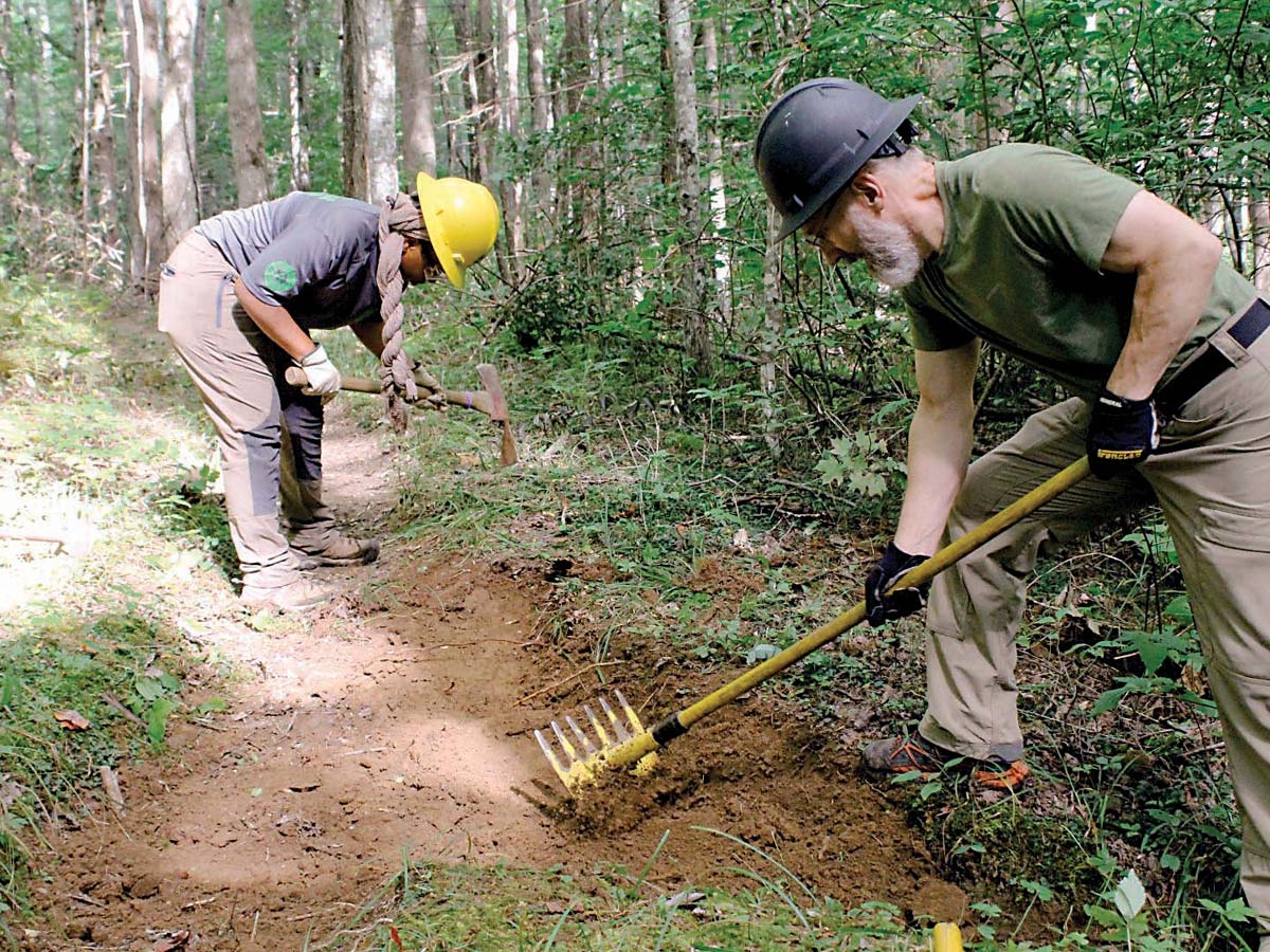 Volunteers work to repair trail tread. NPS photo
