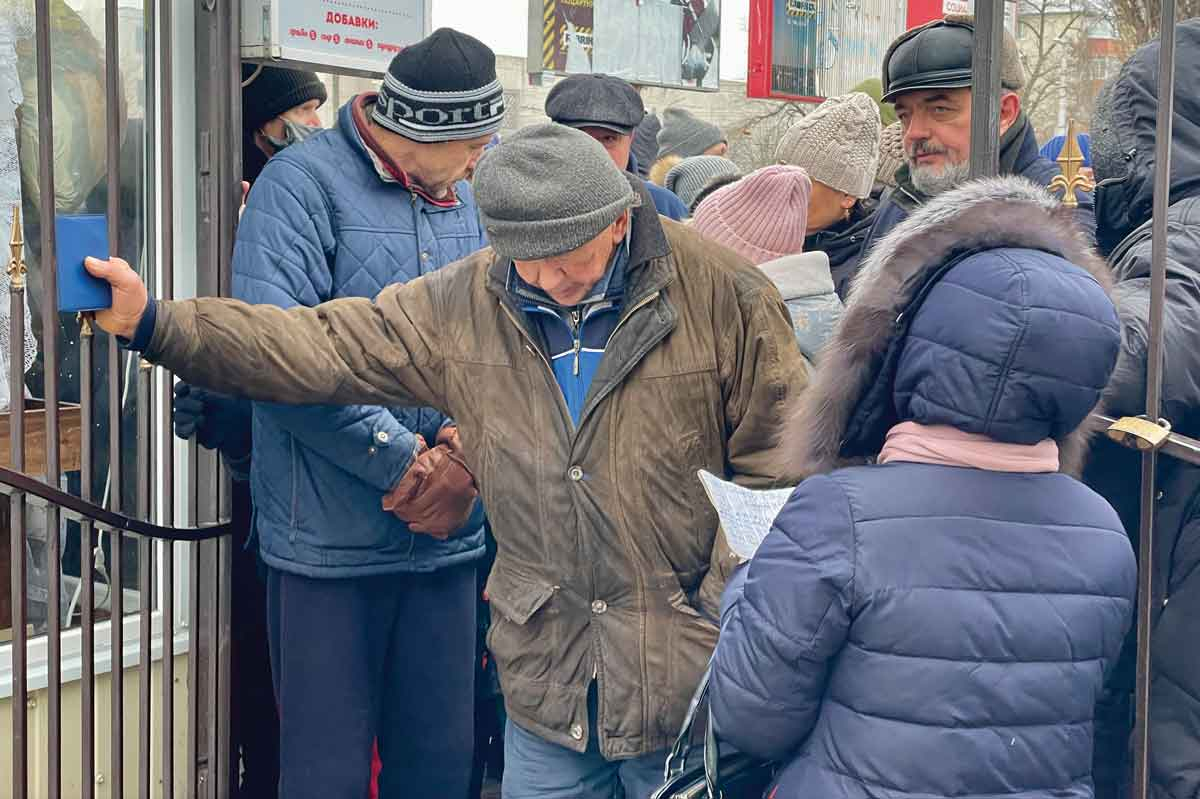 Residents of Kherson, liberated from Russian control in mid-November after eight months of occupation, line up for humanitarian aid on Dec. 6. Cory Vaillancourt photo