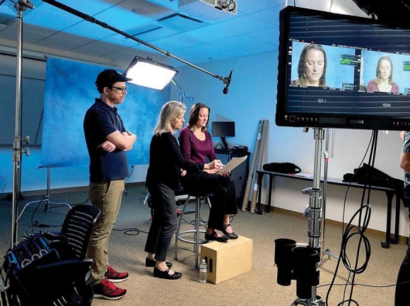 Tamera Pearson (center) of WCU’s School of Nursing reviews a script with family nurse practitioner Jennifer Lewis during filming for a video series related to the opioid epidemic, while filmmaker Rod Murphy looks on.