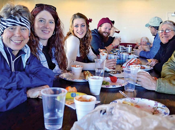 A table full of thru-hikers smiles during the inaugural Chow Down in 2015. Donated photo