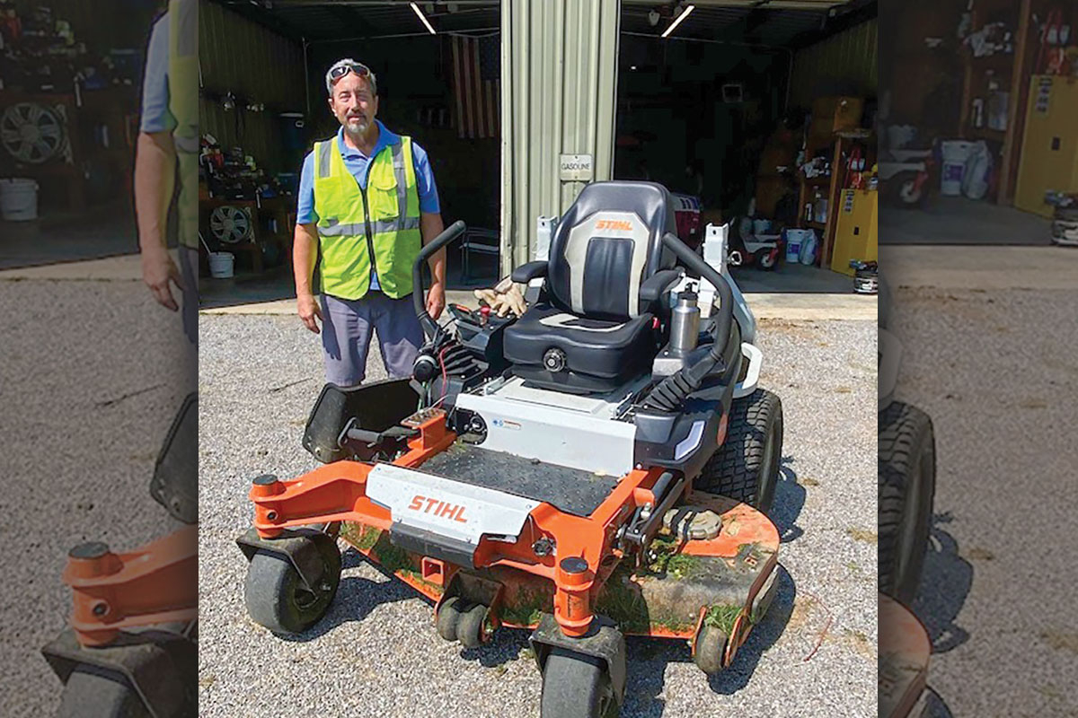 Michael Noland, Outdoor Maintenance supervisor for Town of Waynesville Parks and Recreation Department beside the town’s electric mower. Donated photo