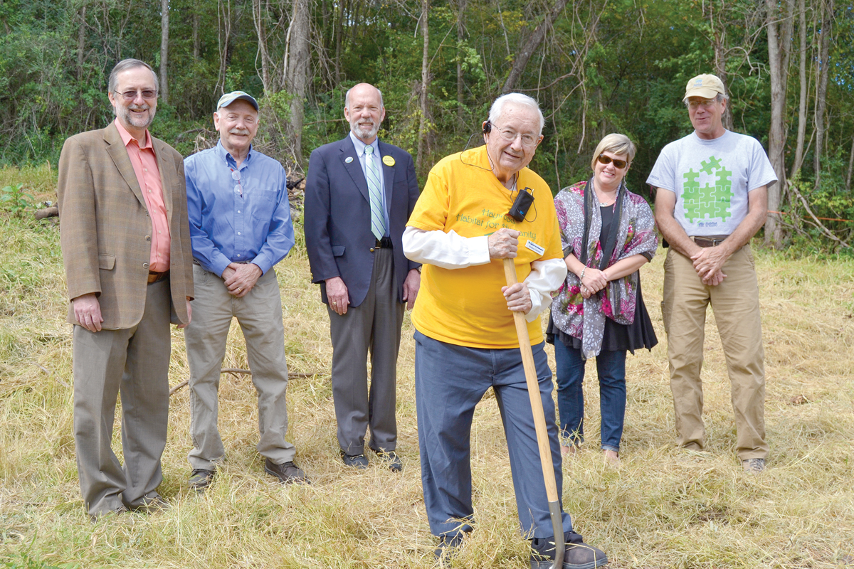 Volunteers break ground on the Walton Woods neighborhood after the land donation in 2009. Donated photo