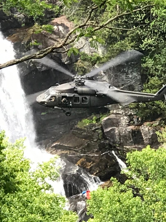 A National Guard N.C. Helicopter Aquatic Rescue Team unit drops down supplies during the search for Chandler Manuel Wednesday, May 6. Kelly Donaldson photo