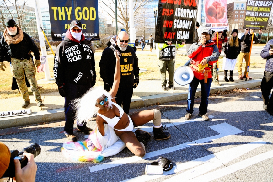A counter-demonstrator (bottom) taunts a religious group near Washington, D.C.’s Union Station. 