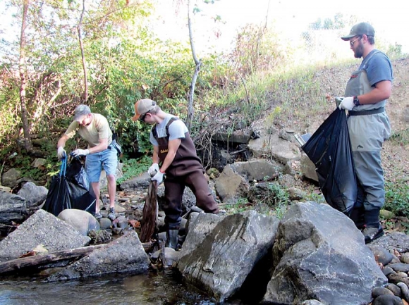 Volunteers pick up trash along Allens Creek. Donated photo