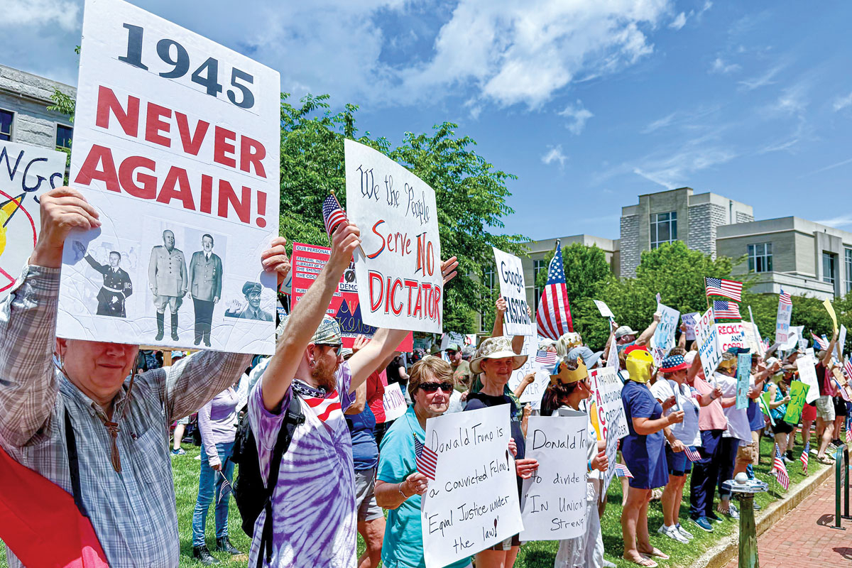 A large crowd showed up for Waynesville’s “No Kings” rally, and many brought signs.