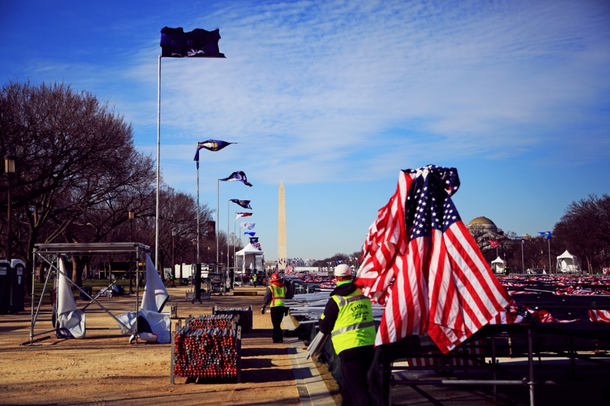 Workers remove what&#039;s left of the inaugural ceremonies in Washington D.C. on Thursday, Jan. 21. 