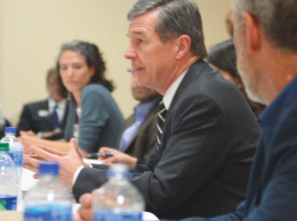 Gov. Roy Cooper (center) addresses a community roundable in Haywood County April 24. Cory Vaillancourt photo