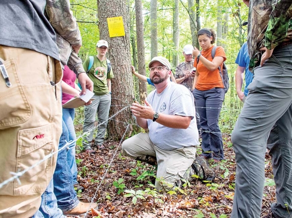 Study field manager Sam Millman talks to a group of students at a trap site. Kristy Keel-Blackman photo