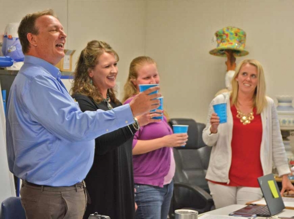 Shining Rock board members Mike Mehaffey (from left), Michelle Haynes and Melanie Norman toast to outgoing Board Chair Anna Eason (far right). Cory Vaillancourt photo