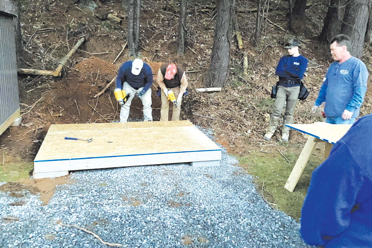 HCC Construction Technology students build shed platforms for Waynesville HousingAuthority houses. Corey Isbell Photo 