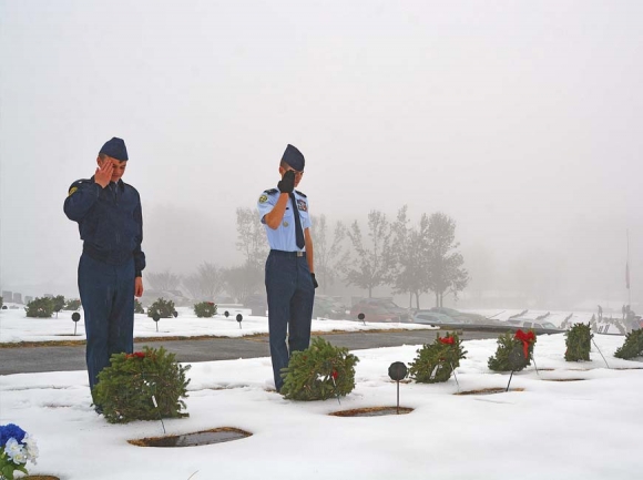 Cadets from the Tuscola High School AFJROTC place wreaths in Green Hill Cemetery the morning of Dec. 16. Cory Vaillancourt photo