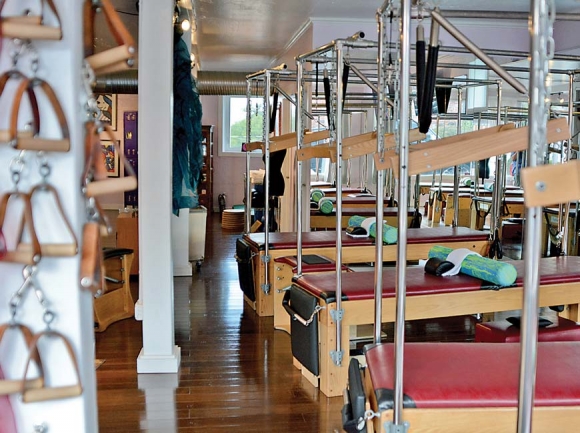 Nikki Perkovich’s Pilates studio features a video link to her other studio, in Miami. Cory Vaillancourt photo