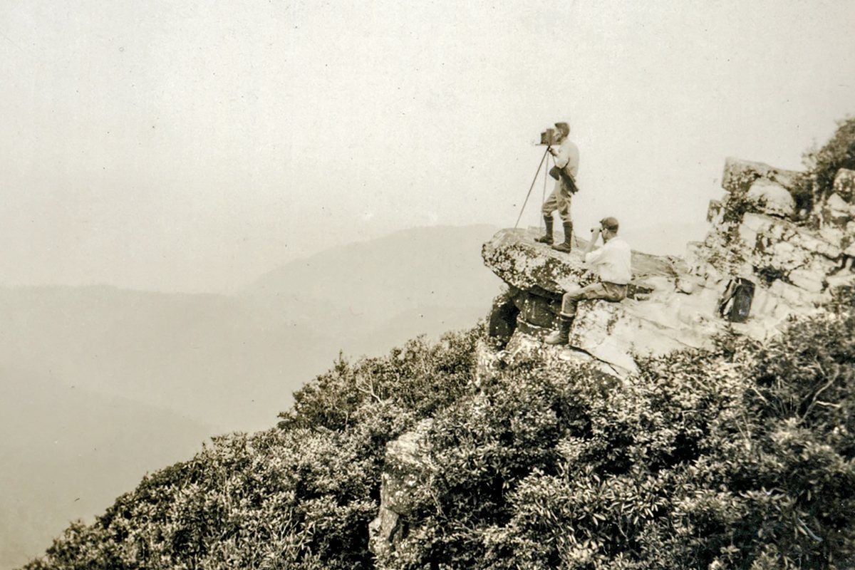 The photograph, depicting Masa on a rock outcrop with his camera and a companion, was previously believed to have been taken at Graybeard Mountain. Recent findings confirm that the actual location is Blackstack Cliffs in the Cherokee National Forest. Donated photos