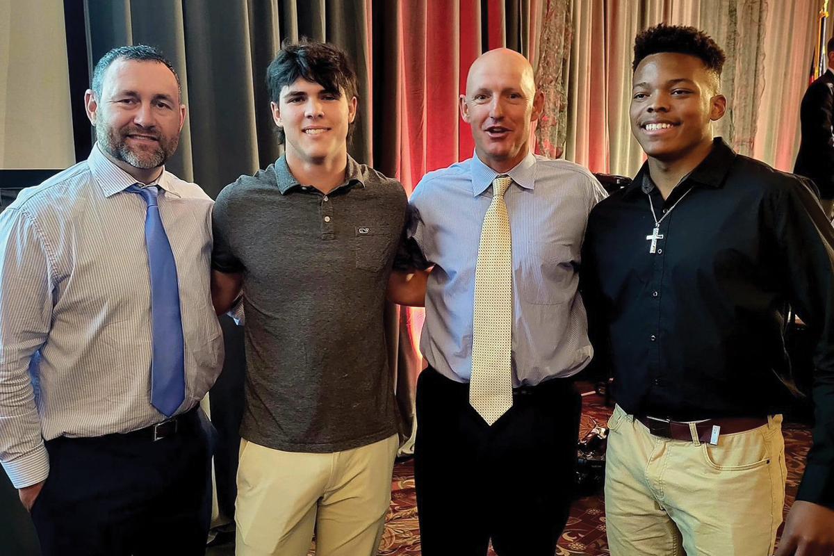 Coach Josh Brooks (second from right) returns to Franklin’s football program after less than a year away. Donated photo