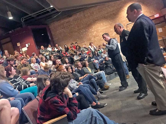 Swain County High School Principal Mark Sale (from left) Sheriff Curtis Cochran and Assistant District Attorney Jason Arnold speak to students about the seriousness of making threats at school. Jessi Stone photo
