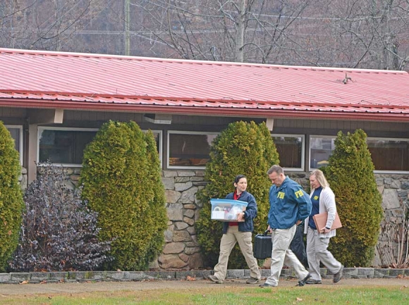 FBI agents raid the Qualla Housing Authority in February 2017. Holly Kays photo