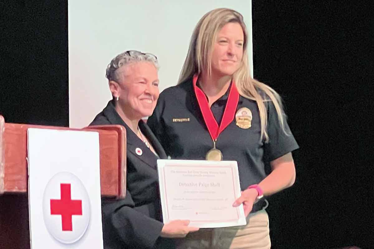 Waynesville Police Det. Paige Shell was awarded by the Red Cross at a recent event in Asheville for her lifesaving actions.