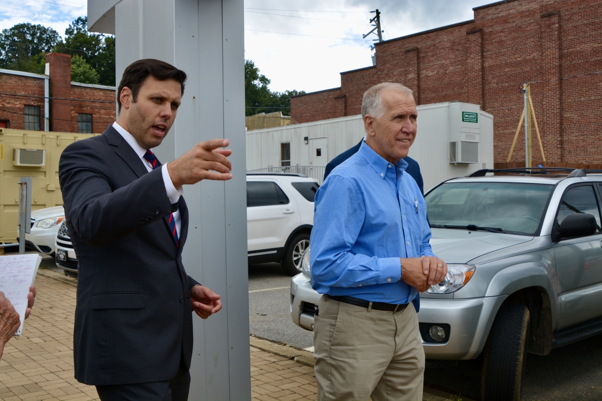 Canton Mayor Zeb Smathers (left) leads Sen. Thom Tillis through Canton, touring the damage  caused by deadly flooding this past August. 