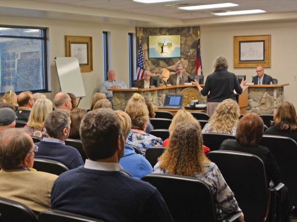 People speak out against consolidating the health department and the department of social services in Jackson County during a commissioner meeting last year. File photo