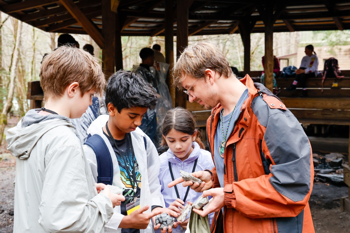 Tremont Teacher-Naturalist Jeremy Johnson talks rocks with a group of students from Rockwood School District in Missouri. 