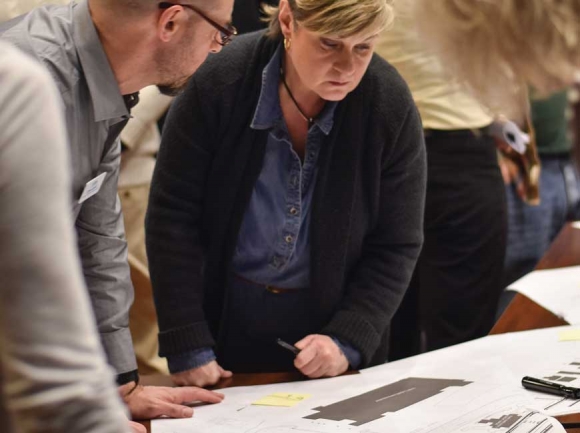 Asheville Design Center Director Chris Joyell, left, talks to community members during a Jan. 14 meeting. Holly Kays photo 