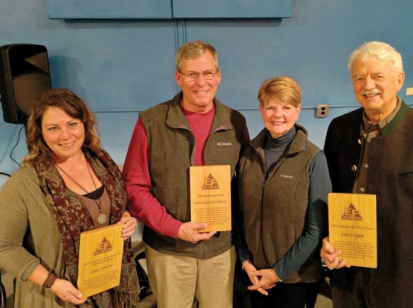 Retired Haywood Community College forestry instructor John Palmer (right) received the 2019 EcoForesters Root Cause Lifetime Achievement Award, with Aimee Tomcho of the Audubon Society (left) winning the Sustainable Use of Forest Products Award and landowners Linda and Ellis Fincher receiving the EcoForester of the Year Award. Donated photo 