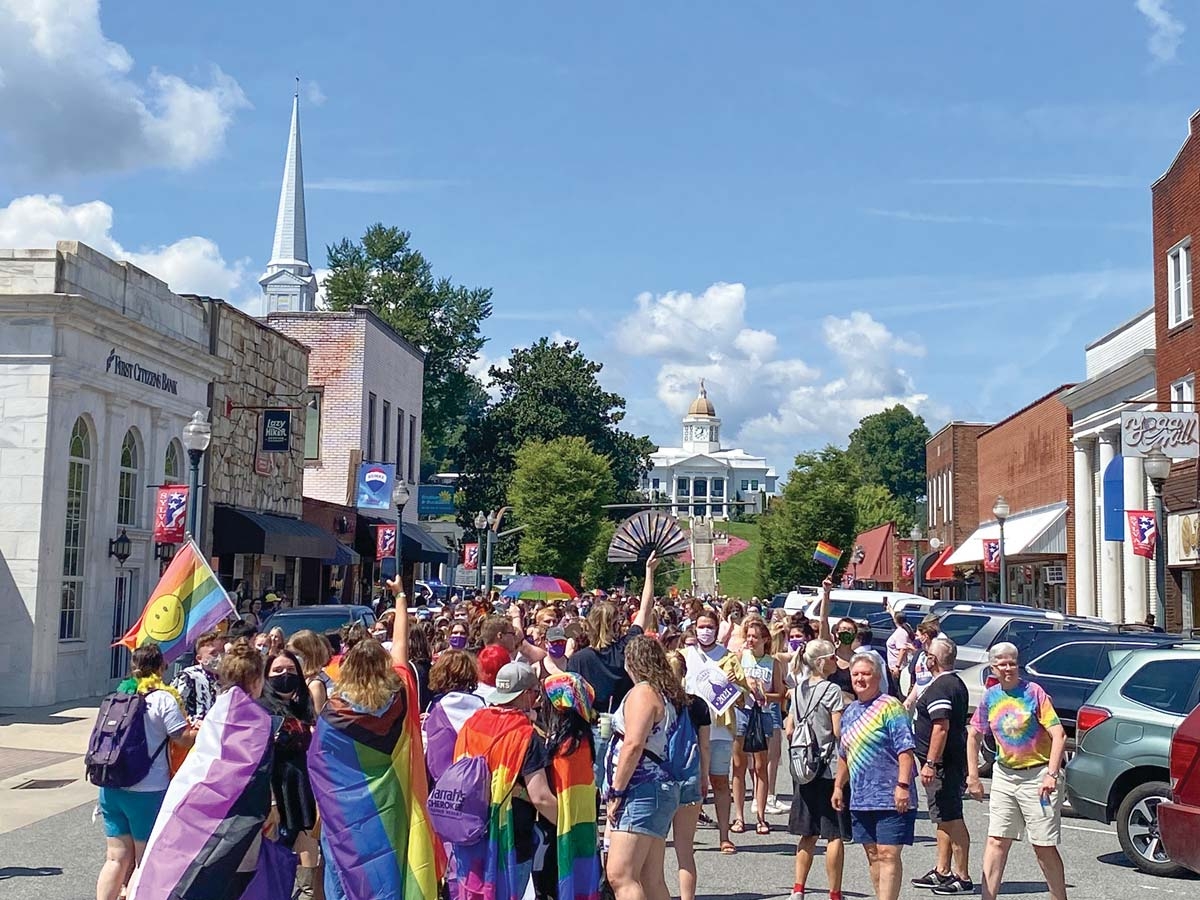 Pride Parade participants march down Main Street in Downtown Sylva. Hannah McLeod photo
