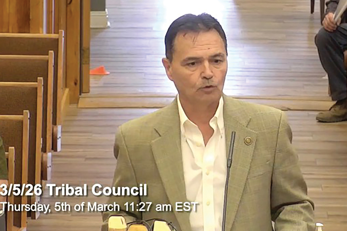 Co-author Patrick Lambert speaks to tribal council about the name change resolution. 